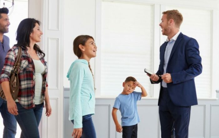 family with agent viewing a home